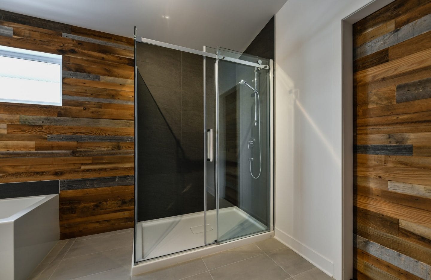 modern bathroom with barn wood european shower e1666504631762