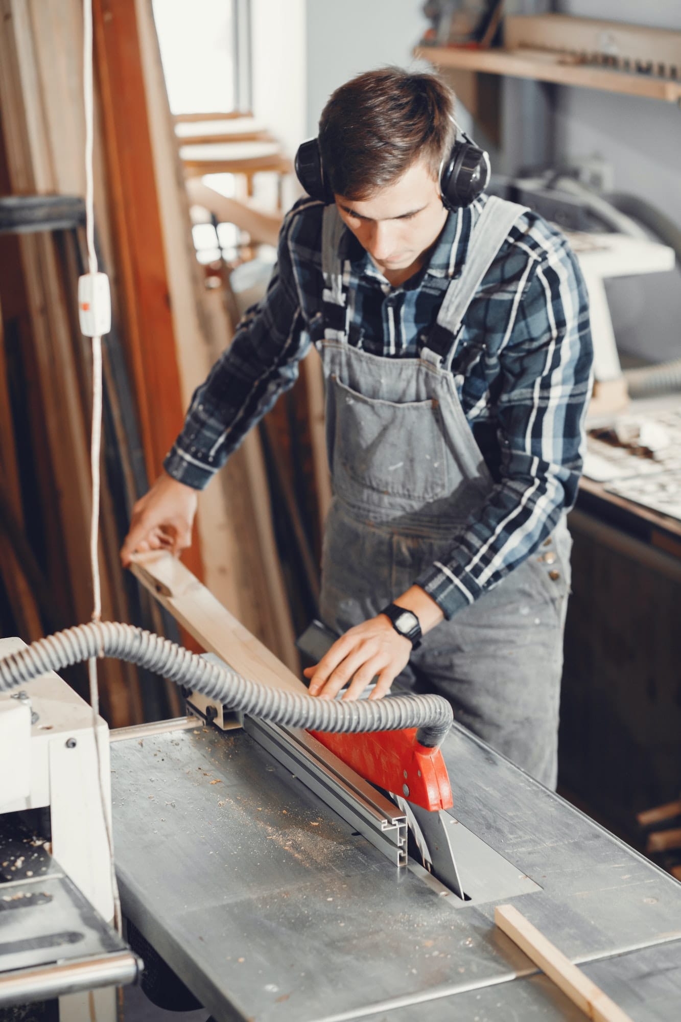 the carpenter works with a tree